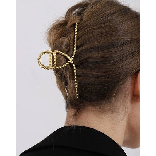 Minimalistische Haarspange mit verdrehter Linie und großer Kralle
